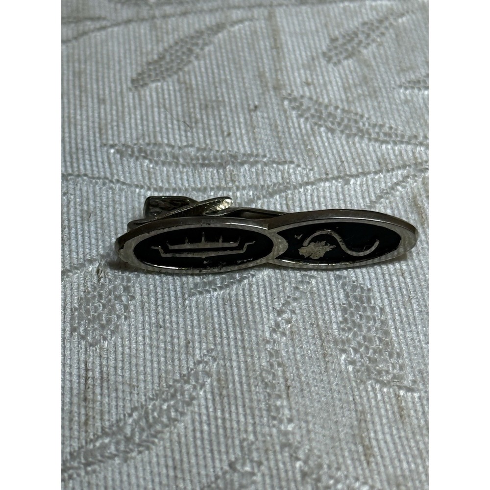 Vintage Anson tie clip featuring a crown‎ and sine wave